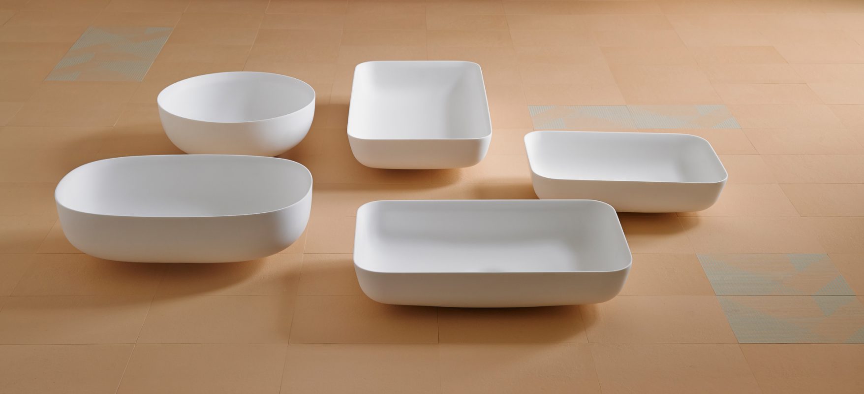 collection of cerclo, ovalo and quadro corian top or undeer mounted washbasins
